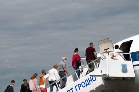 Minsk, Belarus - June 5, 2021: People go to the plane.のeditorial素材