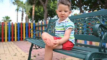 A child injured his foot while playing in the playground.の写真素材