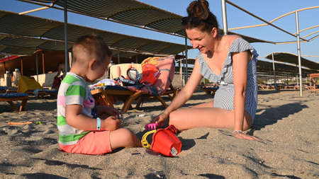 Mom on vacation with a child at the sea.の写真素材