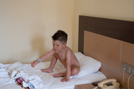 Child resting in a hotel roomの写真素材