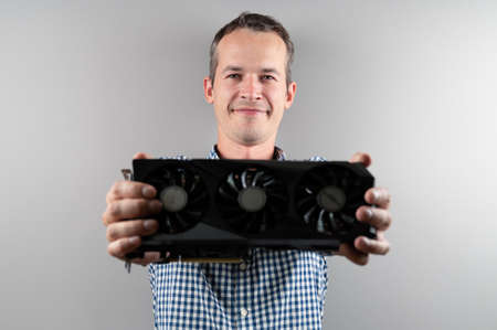 A man bought a graphic card at a saleの写真素材