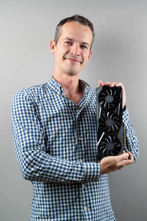 A man holding a video cardの写真素材