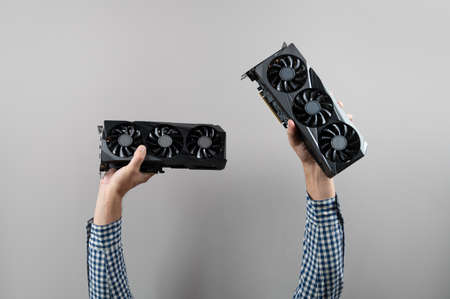 graphic card in hand. Place for inscriptionの写真素材