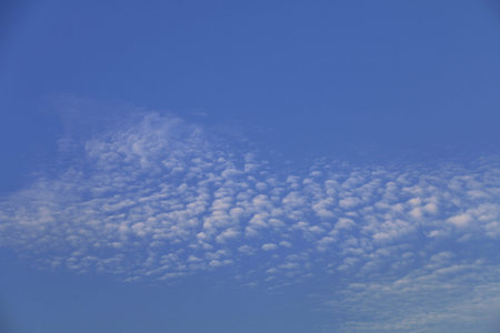Cloudy blue sky abstract background. clouds in the blue sky. blue sky background with tiny clouds