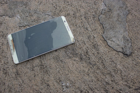 Modern mobile phone with broken screenの写真素材