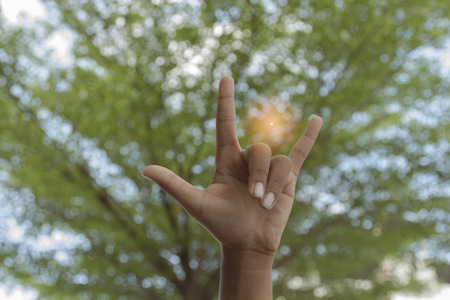 three fingers nature green backgroundの写真素材
