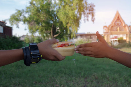 Two boys eating burgersの写真素材