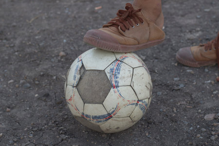 kids are playing soccer football for exercise in the evening.の写真素材