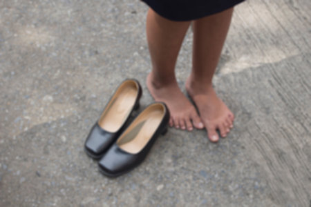 foot pain after, take shoes off. picture  blur.
