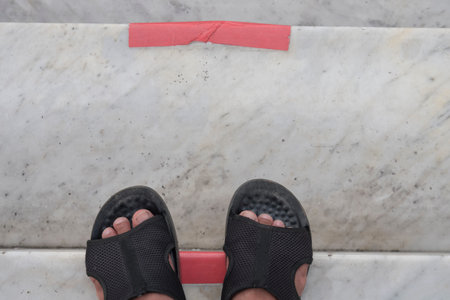 Men wear slippers shoes standing on stair,