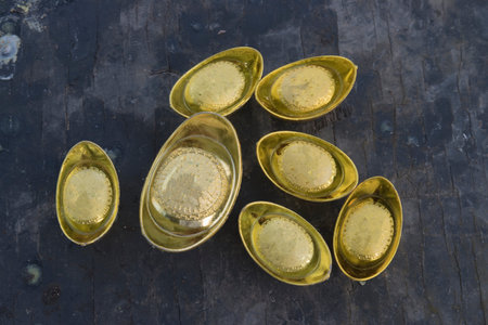 Chinese new year ornament--Stack of gold ingots on white background.