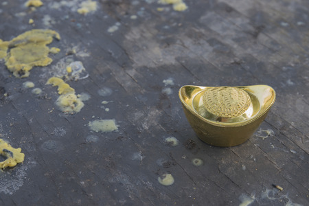 Chinese new year ornament--Stack of gold ingots on white background.の写真素材