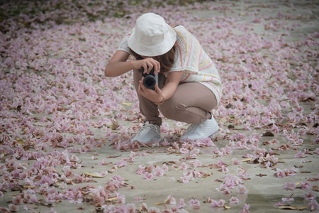 Women photographing flowers on the ground floor. Chompoo Pantip flowers, thailand
