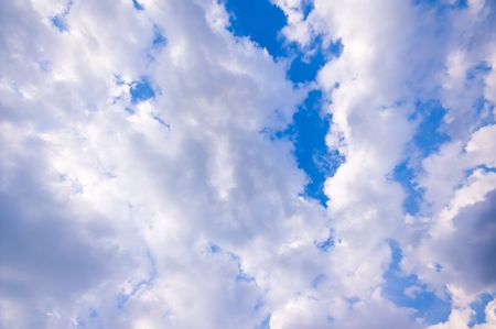 a lot of clouds with a little bit of blue sky visibleの写真素材