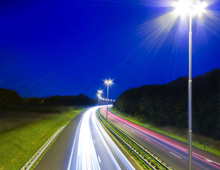 highway with traffic lights making lines in the dark
