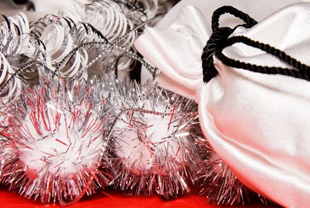 xmas decoration with gift bag on a red cloth の写真素材