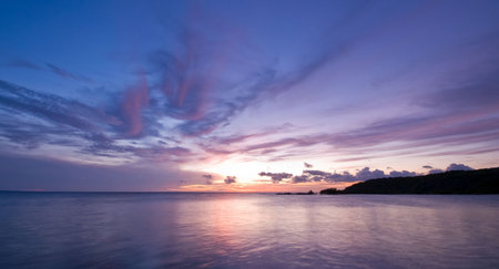 nice pastel blue sea sunset with sun disappear in the seaの写真素材