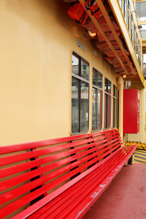 Empty red bench seat on ferry boatの写真素材