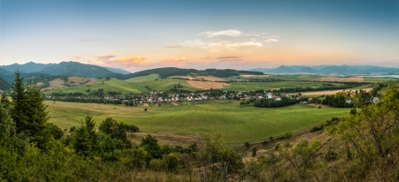 Nature Landscape with Village and Mountains, View Towards West Tatra and Low Tatra Mountainsの写真素材