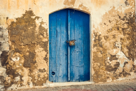 Locked Wooden Front Door of the Old House with Big Lock in Mahdia, Tunisiaの写真素材