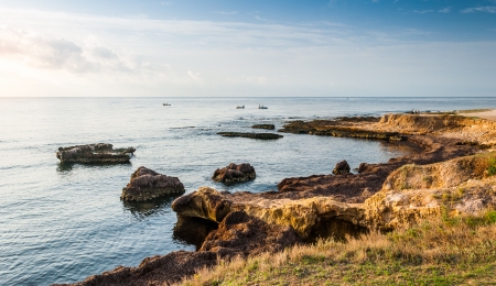 Rocky Coast and See with Fishermen in the Morning in Mahdia, Tunisiaの写真素材