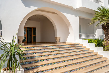 Stairs with Plants and Entrance to the Hotel