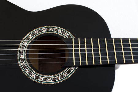 Detail of Black Wooden Classical Acoustic Guitar Isolated on a White Backgroundの写真素材