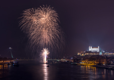 New Year Celebration. Fireworks on the River in Bratislava, Slovakia.の写真素材