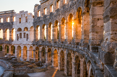 Architecture Details of the Roman Amphitheater Arena in Sunny Summer Evening. Famous Travel Destination in Pula, Croatia.の写真素材