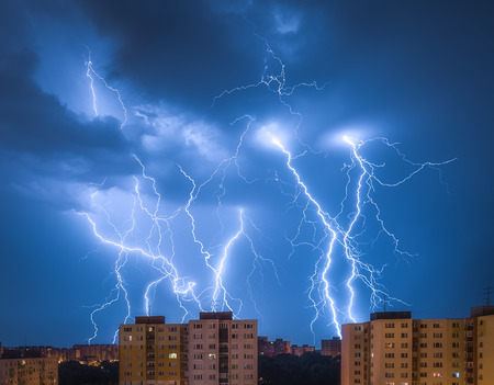 Many Lightnings Over Housing Estate. Night Storm in the City.の写真素材