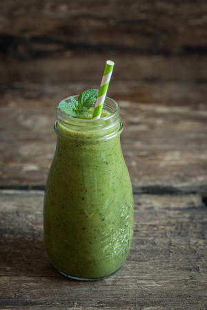 Fresh Green Smoothie on Rustic Woodの写真素材