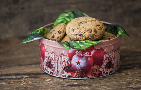 Freshly Baked Cookies  or Biscuits in a Bucket on Rustic Wooden Tableの写真素材
