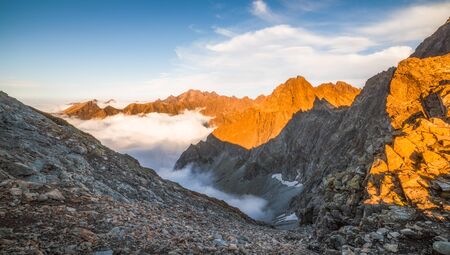 Mountains Landscape with Inversion at Sunset as seen from Sedlo Vaha in High Tatras, Slovakiaの写真素材