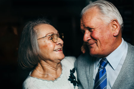 Happy elderly couple in love smiling at each otherの写真素材