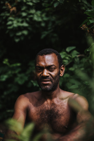 portrait of serious looking black man outdoors