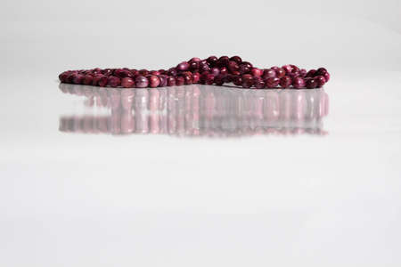 Red necklace and reflection of beadsの写真素材