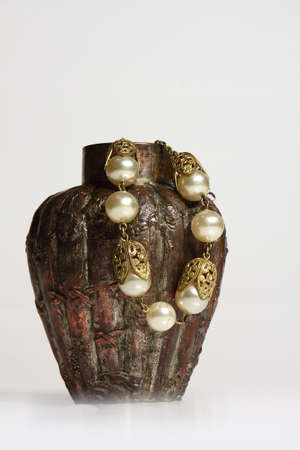 Bronze pot with inscriptions and with necklaceの写真素材