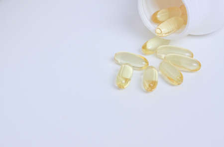 Pills spilling out of pill bottleの写真素材