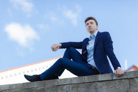 Business man relaxing after work with a sense of satisfactionの写真素材