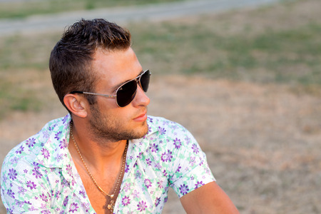 Portrait of a Man in a city park at sunset the sunの写真素材