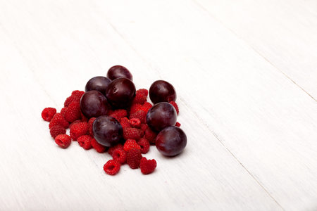 raspberries and plumsの写真素材