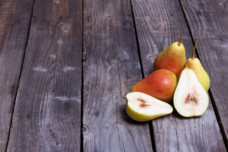 Juicy pears on gray wooden backgroundの写真素材