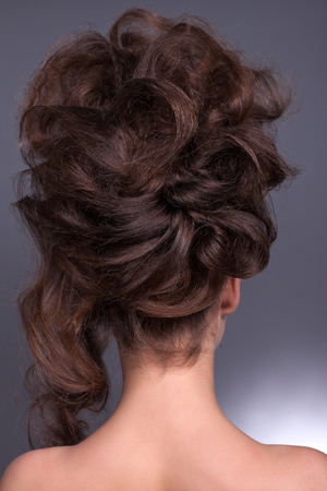 Beautiful creative hairstyle, brunette with long, magnificent hair.の写真素材