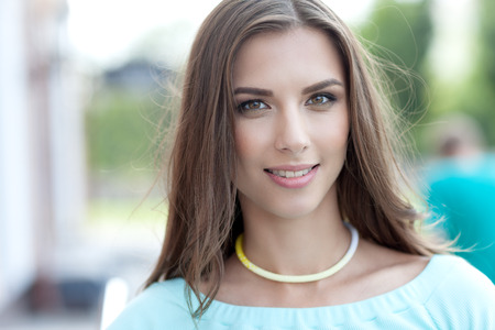 Portrait of a beautiful woman on a street walk. In the youth style.の写真素材