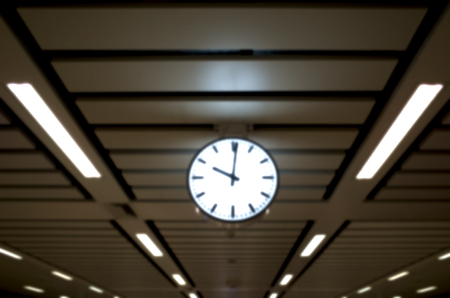 Clock attach on the ceiling in the train station.の写真素材