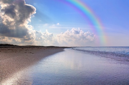 Nice seascape with rainbowの写真素材