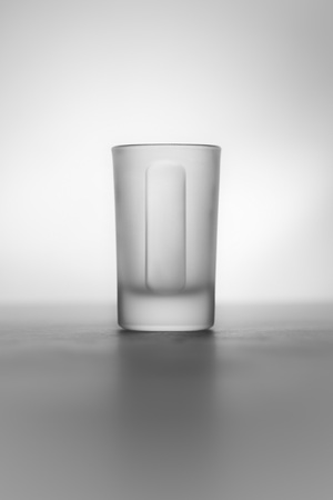 A smart collection of shot glasses with different brands like Averna, Sauza Tequila, Tequila Cuervo, Moskovskaya, Yeni Raki, Jägermeister, absolute, Berentzen, Smirnoff, Molinari Sambuca.の写真素材