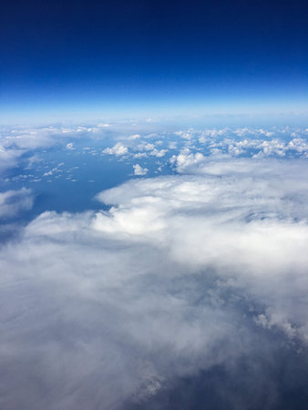 A great view out of the aircraft to the ground. Horizont, sky, clouds and a very interresting...