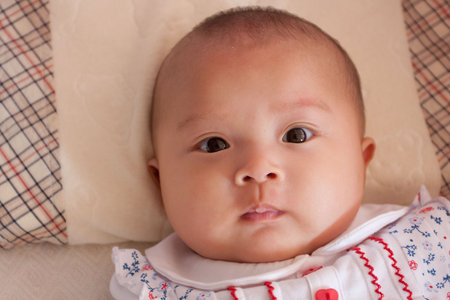 My baby seems serious and without a subtle smile.