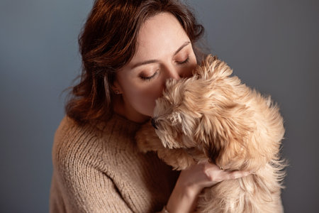 girl kisses her dog, taking care of pets